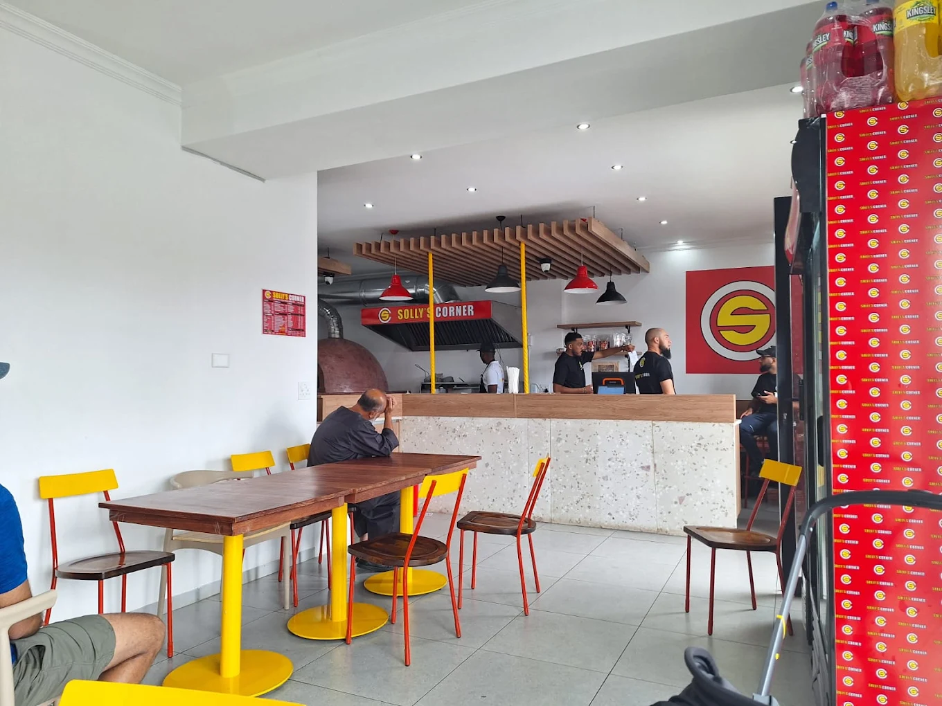 Solly's Corner Lenasia interior with pizza oven and branded counter at Protea Pearl